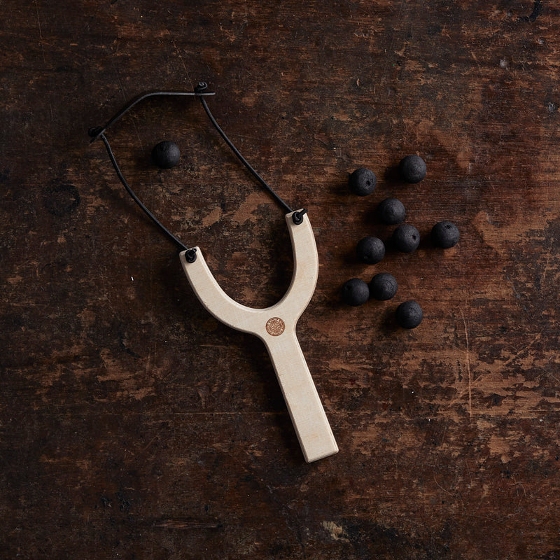 Wooden Slingshot with Wadded Paper Bullets