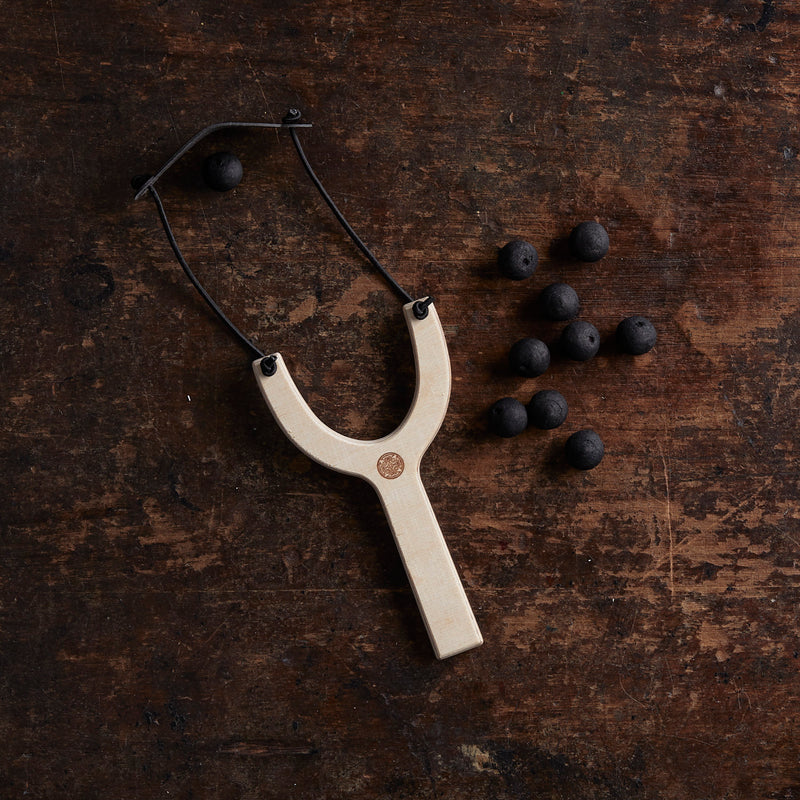 Wooden Slingshot with Wadded Paper Bullets