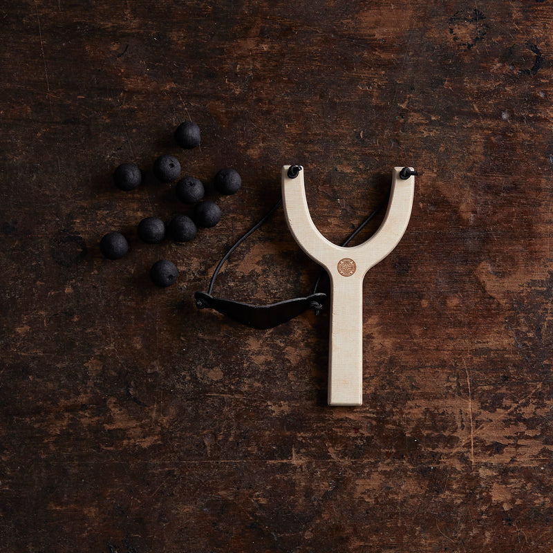 Wooden Slingshot with Wadded Paper Bullets