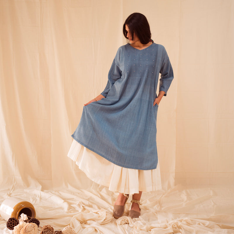 pleated indian dress That is a striking piece! It looks like a contemporary take on traditional Indian wear, likely a pleated Indo-western midi dress featuring a structured corset-style bodice with a modern twist. The