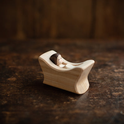 Handcrafted Wooden Child In Cradle